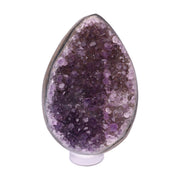 Kleines Amethyst Rainbow Ei mit natürlicher Druzy- Kristalloberfläche und Farbspiel aus Violett, Purpur und warmen Naturtönen.