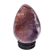 Kleines Amethyst Rainbow Ei mit natürlicher Druzy- Kristalloberfläche und Farbspiel aus Violett, Purpur und warmen Naturtönen.