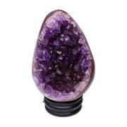 Kleines Amethyst Rainbow Ei mit natürlicher Druzy- Kristalloberfläche und Farbspiel aus Violett, Purpur und warmen Naturtönen.