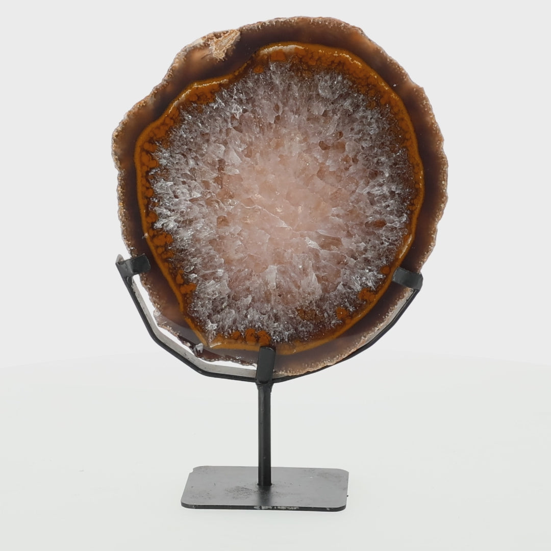 Load video: Ice Core Agate Slice on Stand - deep brown agate with crystal center